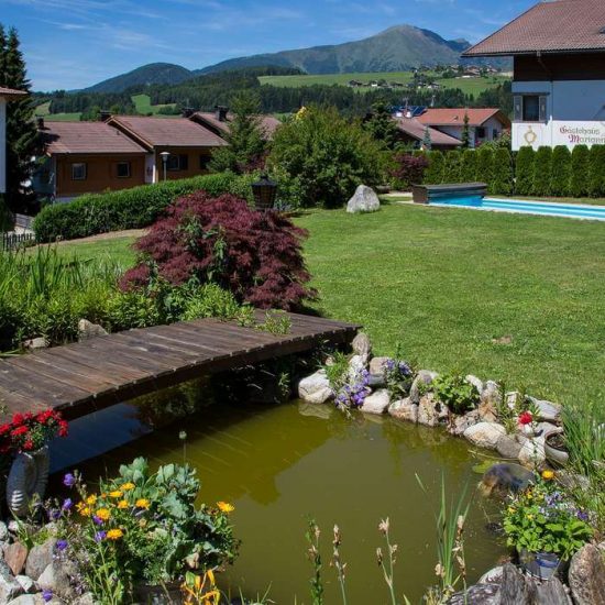 Hotel with garden and sunbathing lawn